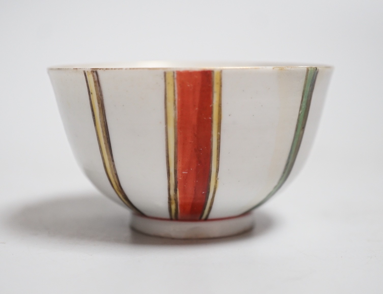 A Venice, Cozzi porcelain teabowl with polychrome vertical stripes, c.1765, 7.3cms diameter